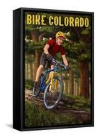 Colorado - Mountain Biker in Trees-Lantern Press-Framed Stretched Canvas