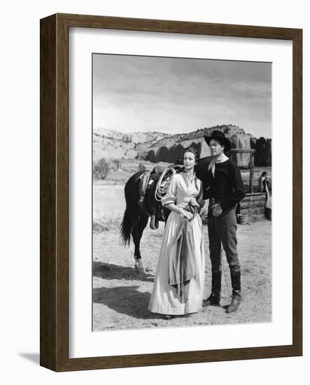 COLORADO TERRITORY, 1949 directed by RAOUL WALSH Dorothy Malone and Joel McCrea (b/w photo)-null-Framed Photo