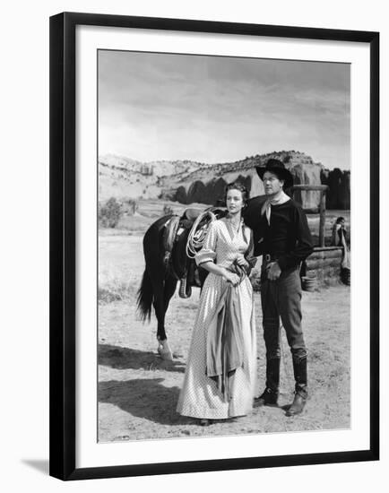 COLORADO TERRITORY, 1949 directed by RAOUL WALSH Dorothy Malone and Joel McCrea (b/w photo)-null-Framed Photo