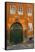 Colorful Building with Bikes Parked Outside, Copenhagen, Denmark-Inger Hogstrom-Framed Stretched Canvas