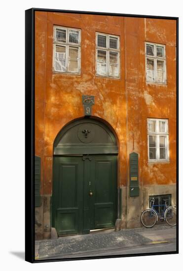 Colorful Building with Bikes Parked Outside, Copenhagen, Denmark-Inger Hogstrom-Framed Stretched Canvas