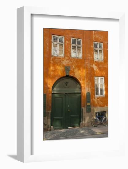 Colorful Building with Bikes Parked Outside, Copenhagen, Denmark-Inger Hogstrom-Framed Photographic Print