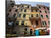 Colorful buildings with clothes hanging out to dry, Riomaggiore, La Spezia, Liguria, Italy-null-Stretched Canvas