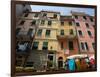 Colorful buildings with clothes hanging out to dry, Riomaggiore, La Spezia, Liguria, Italy-null-Framed Photographic Print