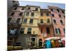 Colorful buildings with clothes hanging out to dry, Riomaggiore, La Spezia, Liguria, Italy-null-Mounted Photographic Print