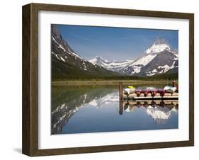 Colorful Canoes Line the Dock at Many Glacier Lodge on Swiftcurrent Lake During Sunrise-Brad Beck-Framed Photographic Print