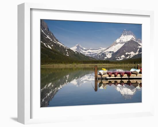 Colorful Canoes Line the Dock at Many Glacier Lodge on Swiftcurrent Lake During Sunrise-Brad Beck-Framed Photographic Print