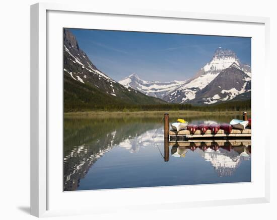 Colorful Canoes Line the Dock at Many Glacier Lodge on Swiftcurrent Lake During Sunrise-Brad Beck-Framed Photographic Print