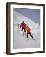 Colorful Couple Cross Country Skiing-null-Framed Photographic Print