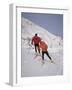 Colorful Couple Cross Country Skiing-null-Framed Photographic Print