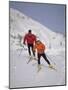 Colorful Couple Cross Country Skiing-null-Mounted Photographic Print