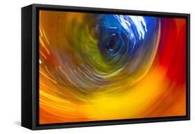 Colorful glass with blurred motion effect.-Stuart Westmorland-Framed Stretched Canvas