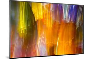 Colorful glass with blurred motion effect.-Stuart Westmorland-Mounted Photographic Print