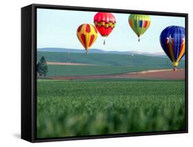 Colorful Hot Air Balloons Float over a Wheat Field in Walla Walla, Washington, USA-William Sutton-Framed Stretched Canvas