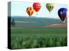 Colorful Hot Air Balloons Float over a Wheat Field in Walla Walla, Washington, USA-William Sutton-Stretched Canvas