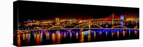 Colorful illumination of Dragon Bridge over Han River, Tet Festival, New Year celebration, Vietnam.-Tom Norring-Stretched Canvas