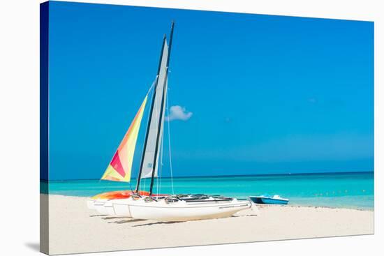 Colorful Sailing Boats for Rent on a Sunny Day at Varadero Beach in Cuba-Kamira-Stretched Canvas