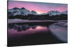 Colorful sky at sunrise on snowcapped mountains and frozen Lake Silvaplana, Maloja, Engadine-Roberto Moiola-Stretched Canvas