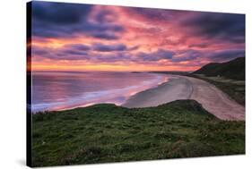Colorful Sunset over the Beach in Rhossili on the Gower Peninsula, Wales, United Kingdom-Frances Gallogly-Stretched Canvas