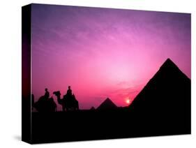 Colorful Sunset Silhouetting Men and Camels at the Great Pyramids of Giza, Egypt-Bill Bachmann-Stretched Canvas