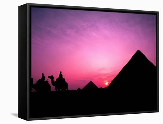 Colorful Sunset Silhouetting Men and Camels at the Great Pyramids of Giza, Egypt-Bill Bachmann-Framed Stretched Canvas
