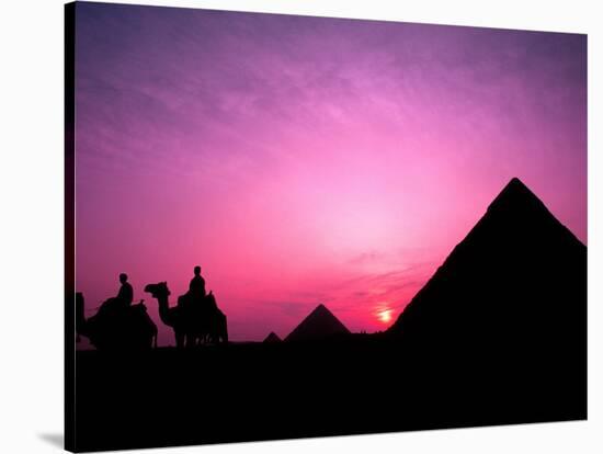 Colorful Sunset Silhouetting Men and Camels at the Great Pyramids of Giza, Egypt-Bill Bachmann-Stretched Canvas