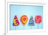 Colorful Vibrant Lollipops, Flat Lay on Blue Background-Marcin Jucha-Framed Photographic Print