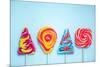 Colorful Vibrant Lollipops, Flat Lay on Blue Background-Marcin Jucha-Mounted Photographic Print