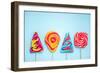 Colorful Vibrant Lollipops, Flat Lay on Blue Background-Marcin Jucha-Framed Photographic Print