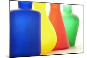 Coloured Bottles in a Row-Tom Quartermaine-Mounted Giclee Print