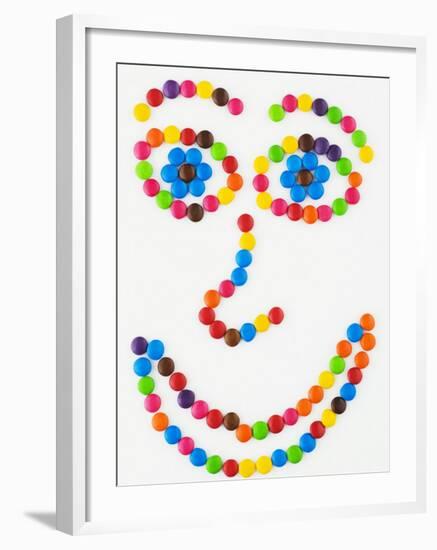 Coloured Chocolate Beans Forming a Smiling Face-Greg Elms-Framed Photographic Print