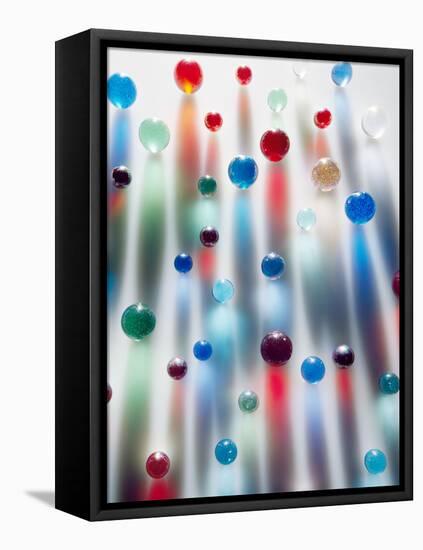 Coloured Marbles Creating Interesting Coloured Long Shadows-Frankie Angel-Framed Stretched Canvas