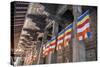 Colourful Buddhist Flags Adorning Columns-Charlie-Stretched Canvas