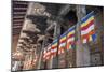 Colourful Buddhist Flags Adorning Columns-Charlie-Mounted Photographic Print