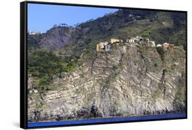 Colourful houses and cliffs atop rocky promontory, Corniglia, Cinque Terre, UNESCO World Heritage S-Eleanor Scriven-Framed Stretched Canvas