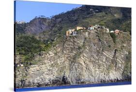 Colourful houses and cliffs atop rocky promontory, Corniglia, Cinque Terre, UNESCO World Heritage S-Eleanor Scriven-Stretched Canvas