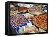 Colourful produce of peppers, garlic, onions, peanuts and shallots, at a market in Denpasar, Bali,-Melissa Kuhnell-Framed Stretched Canvas