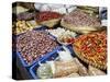 Colourful produce of peppers, garlic, onions, peanuts and shallots, at a market in Denpasar, Bali,-Melissa Kuhnell-Stretched Canvas