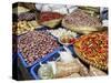 Colourful produce of peppers, garlic, onions, peanuts and shallots, at a market in Denpasar, Bali,-Melissa Kuhnell-Stretched Canvas