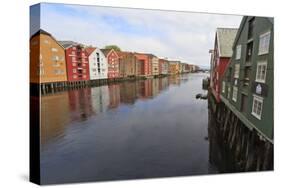 Colourful Wooden Warehouses on Wharves Beside the Nidelva River-Eleanor Scriven-Stretched Canvas