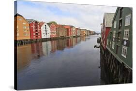 Colourful Wooden Warehouses on Wharves Beside the Nidelva River-Eleanor Scriven-Stretched Canvas