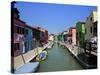 Colourfully Painted Houses Situated on Canal Banks on the Island of Burano, Located Near Venice, Ve-Kimberley Coole-Stretched Canvas