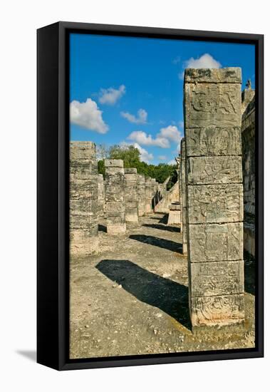 Columns with carved stonework on the Temple of the Warriors at the ancient Mayan city of Chichen...-null-Framed Stretched Canvas