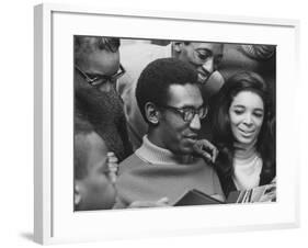 Comedian Bill Cosby Scanning Family Scrapbook with His Wife Camille and Mother-Charles H^ Phillips-Framed Premium Photographic Print