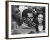 Comedian Bill Cosby Scanning Family Scrapbook with His Wife Camille and Mother-Charles H^ Phillips-Framed Premium Photographic Print