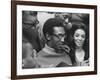 Comedian Bill Cosby Scanning Family Scrapbook with His Wife Camille and Mother-Charles H^ Phillips-Framed Premium Photographic Print