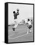 Comedian Bill Cosby Shooting Ball Against His Press Agent, Joe Sutton, During Game of Basketball-Michael Rougier-Framed Stretched Canvas