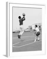 Comedian Bill Cosby Shooting Ball Against His Press Agent, Joe Sutton, During Game of Basketball-Michael Rougier-Framed Premium Photographic Print