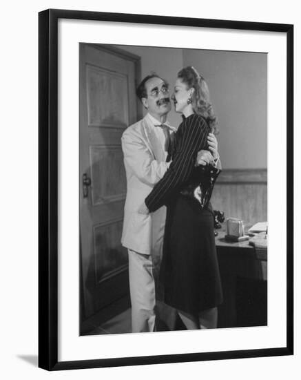 Comedian Groucho Marx Embracing a Woman-null-Framed Photographic Print