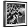 Comedian Milton Berle Trying to Kiss Fans Who Are Asking for Autographs-George Silk-Framed Premium Photographic Print